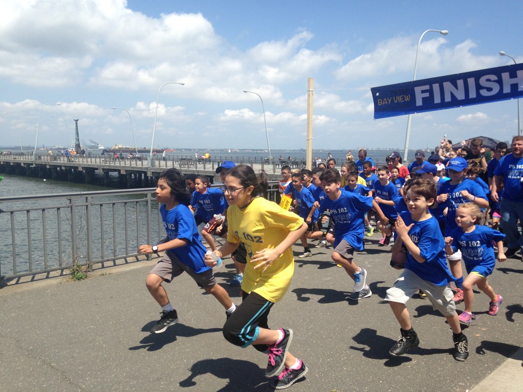 Good deeds inspire P.S. 102 track team to cross finish line in style